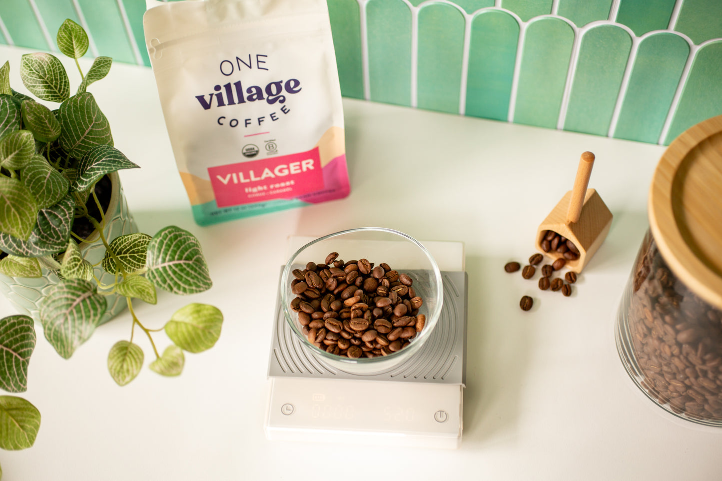 Image of Villager coffee bag and beans in kitchen setting.