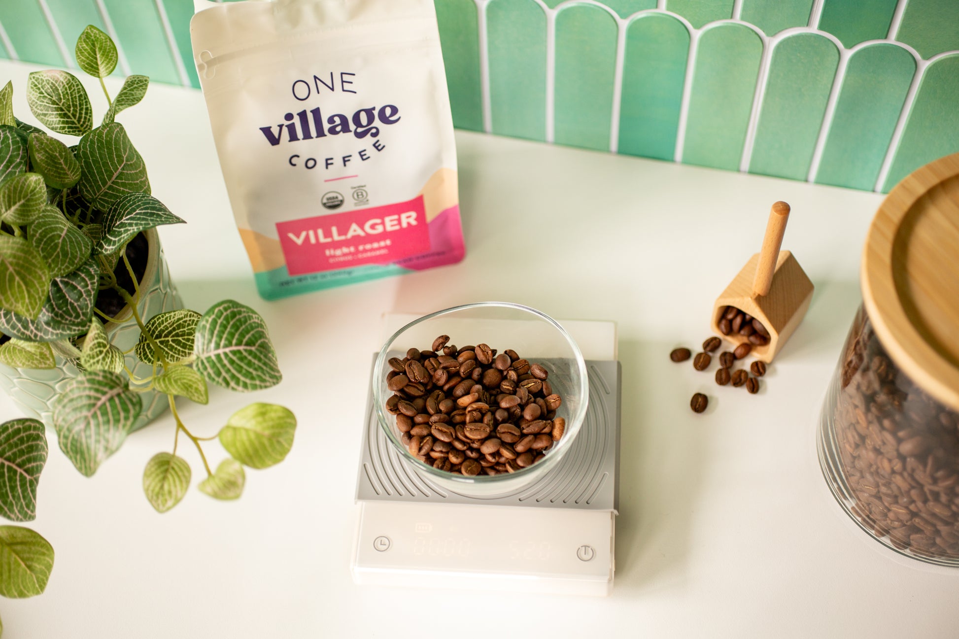 Image of Villager coffee bag and beans in kitchen setting.